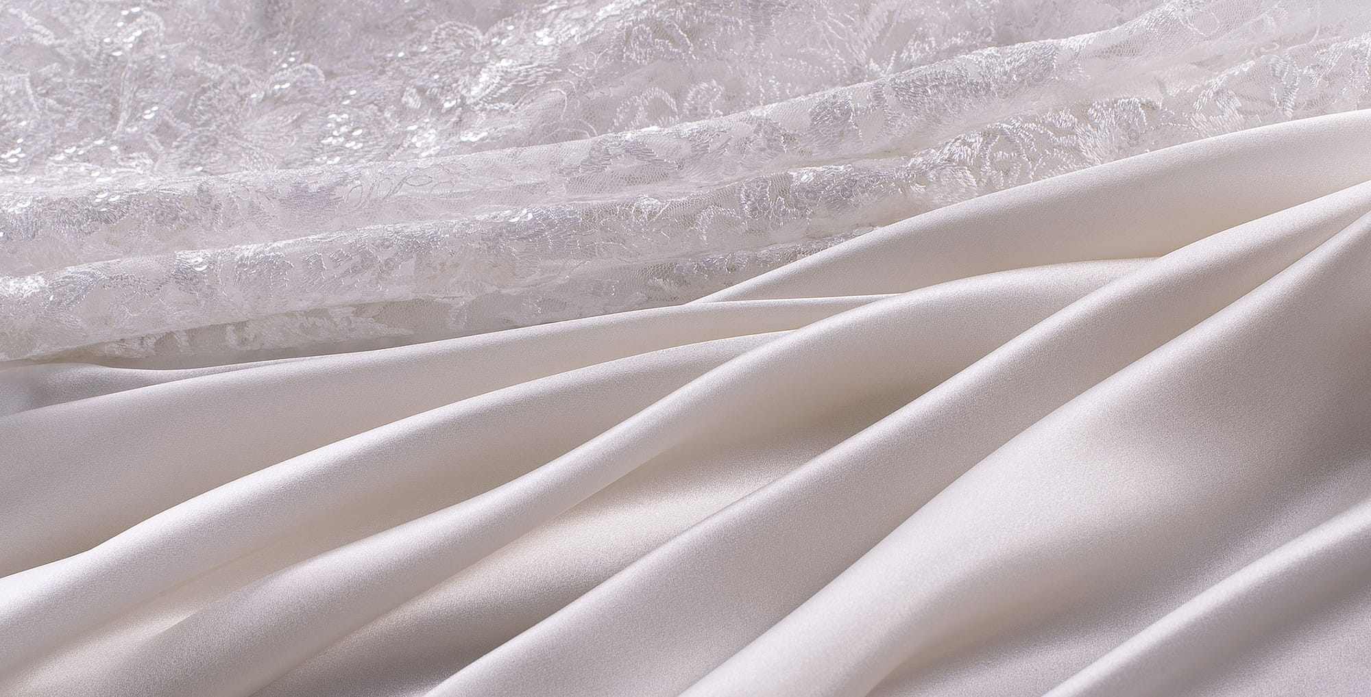 Tessuti e pizzi di colore bianco per abito da sposa | new tess