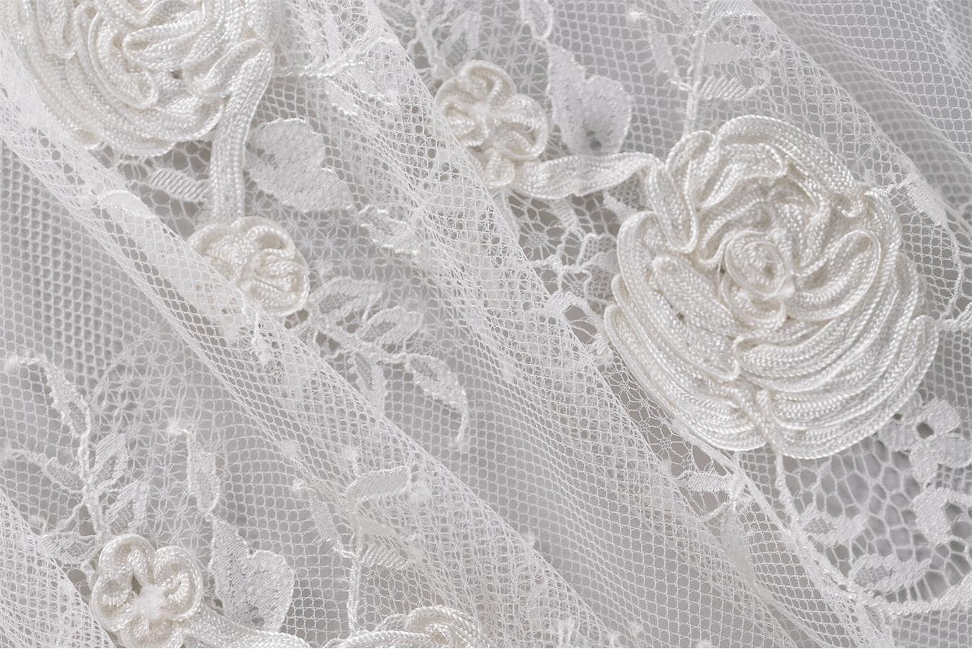 Ivory rebrode lace with floral pattern | new tess bridal fabrics