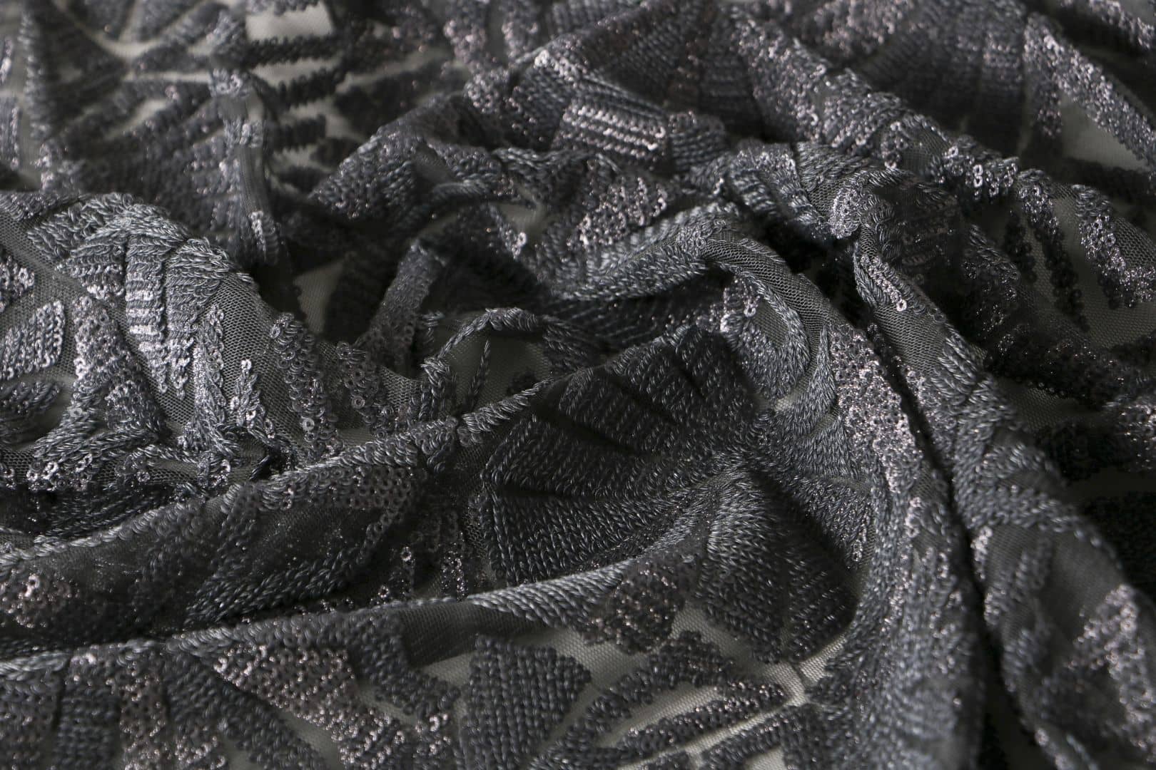 Tessuto Paillettes Nero in Poliestere per abbigliamento