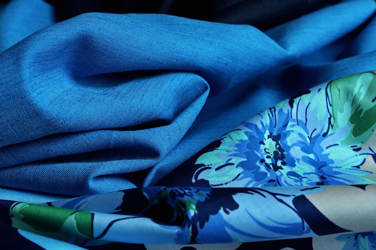 Electric blue plain linen blend and floral cotton sateen fabrics