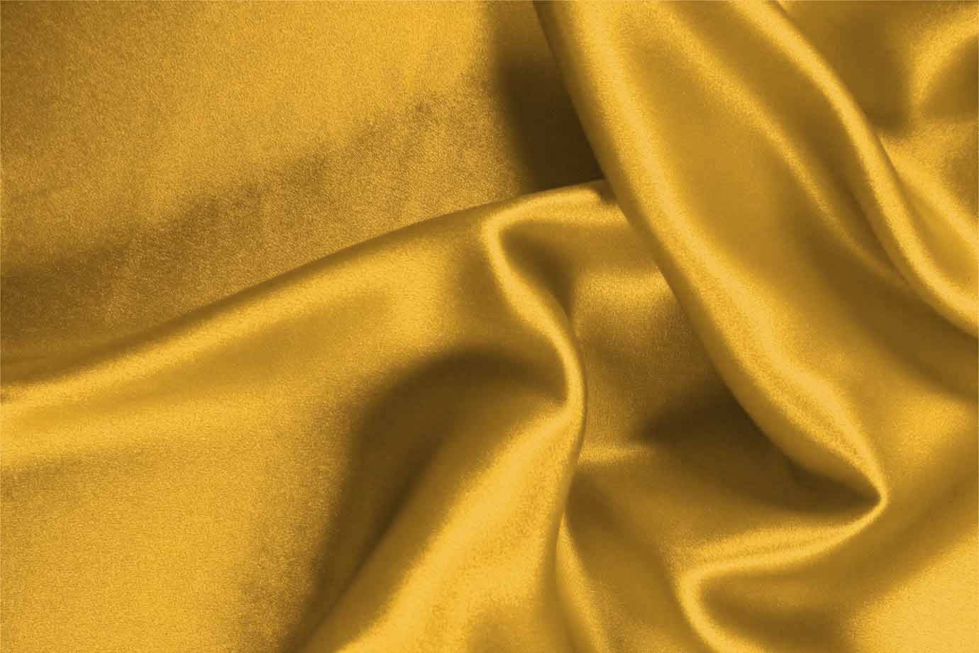 Oil yellow crêpe back satin fabric | new tess