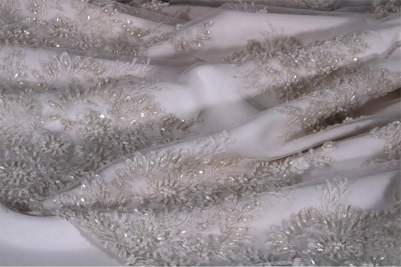 Tissu Pizzo Perlinato 001 Blanc en Polyester