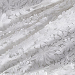 Magnificent white tulle with applied flowers | new tess bridal fabrics