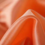 Apricot orange crêpe back satin fabric in pure silk | new tess