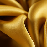 Oil yellow crêpe back satin fabric | new tess