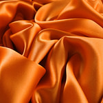 Persimmon orange crêpe back satin fabric | new tess