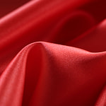 Tomato orange crêpe back satin fabric in pure silk | new tess