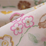 Silk georgette fabric printed in a multicoloured allover floral pattern on a ivory background | new tess