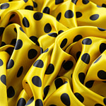 Silk satin fabric printed with a dark blue maxi polka dot motif on a yellow background | new tess