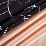 Black polka dot silk crepe and peach silk dogaressa fabric | new tess