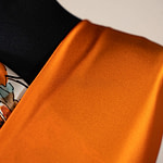 Persimmon orange crêpe back satin fabric | new tess