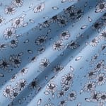 Tessuto floreale in popeline di cotone stampato su fondo azzurro | new tess