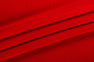 Tessuto Microfibra Crêpe Rosso in Poliestere per abbigliamento