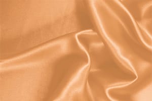 Tessuto Crêpe Satin Arancione Albicocca in Seta per abbigliamento