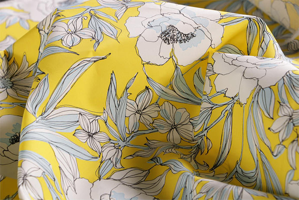 Tessuto floreale in tela di cotone stampato su base gialla | new tess