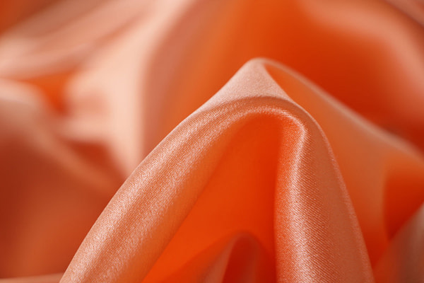 Apricot orange crêpe back satin fabric in pure silk | new tess