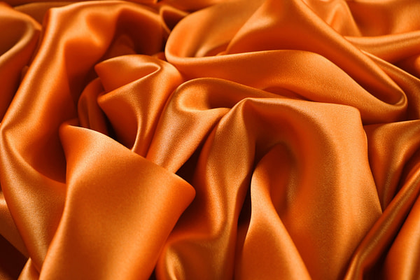 Persimmon orange crêpe back satin fabric | new tess