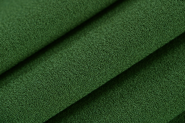 Galles green wool crêpe fabric | new tess
