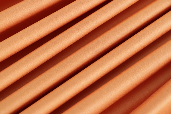 Saffron orange stretch cotton satin fabric | new tess