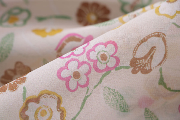 Silk georgette fabric printed in a multicoloured allover floral pattern on a ivory background | new tess