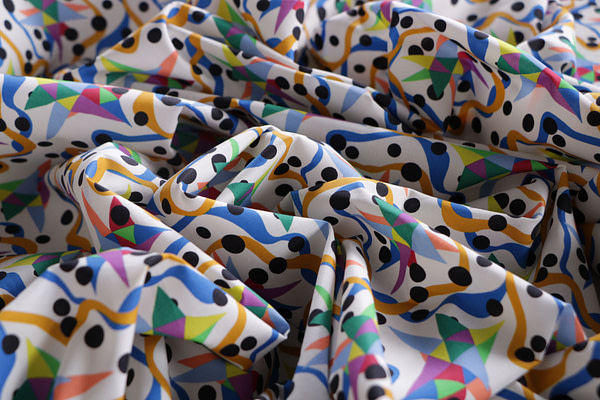Cotton canvas fabric, printed with a multicoloured blue-ochre abstract design | new tess
