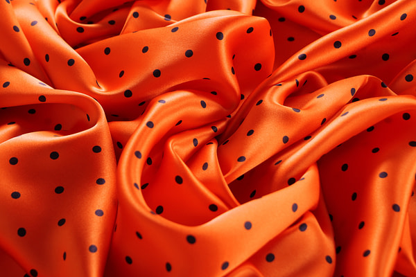 Orange polka dot silk satin fabric | new tess
