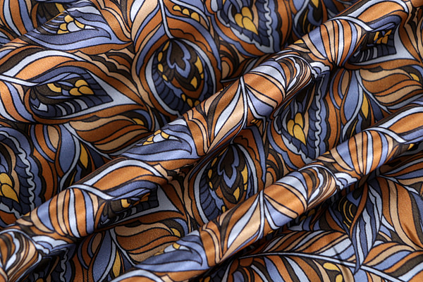 Silk satin fabric printed with a feather-effect pattern in shades of brown | new tess