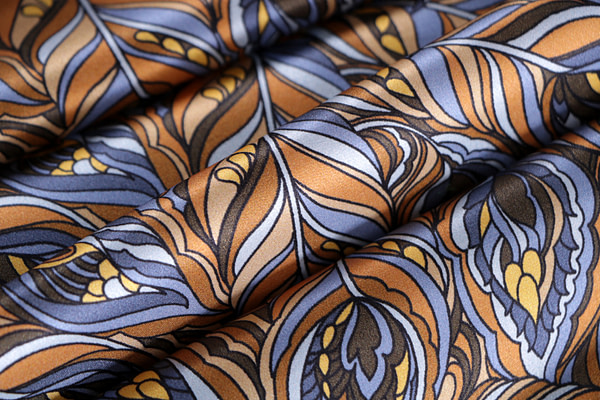 Silk satin fabric printed with a feather-effect pattern in shades of brown | new tess