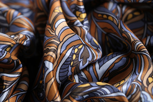 Silk satin fabric printed with a feather-effect pattern in shades of brown | new tess