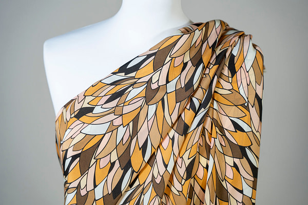 Beige leaves printed crepe de chine fabric | new tess