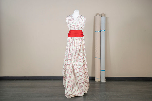 Cotton poplin fabric printed with liberty flowers in red on a white background | new tess