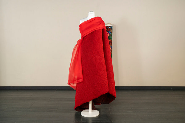 Embossed wool and silk fabric in a vibrant deep red shade | new tess
