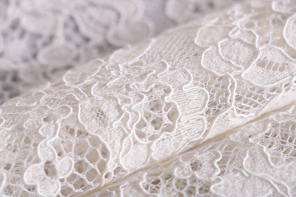 Bridal rebrodé lace fabric in ivory with double scalloping
