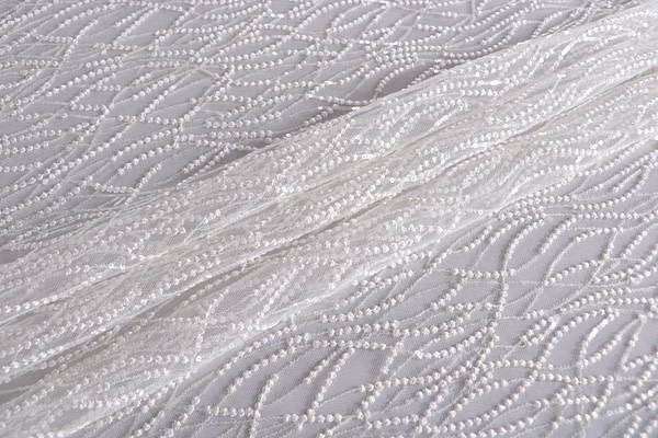 Embroidered white tulle fabric with micro-sequins - new tess