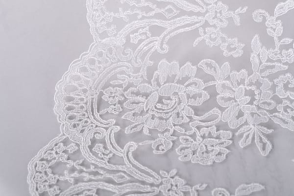 White embroidered rebrodé tulle with scallop | new tess bridal fabrics