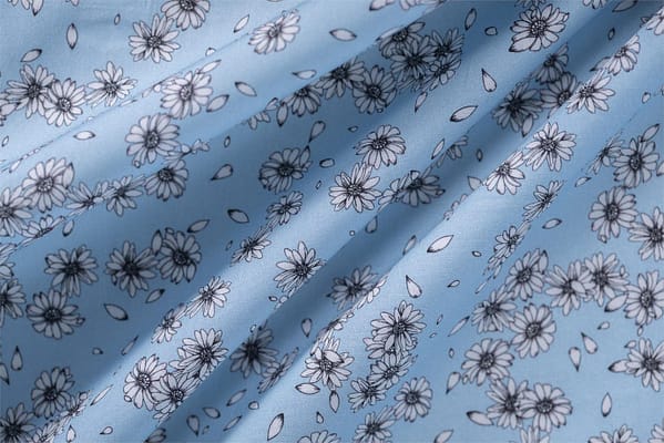 Floral cotton poplin fabric printed on a light blue background | new tess