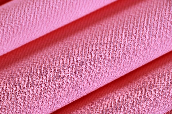 Tessuto Microfibra Crêpe Rosa in Poliestere per abbigliamento